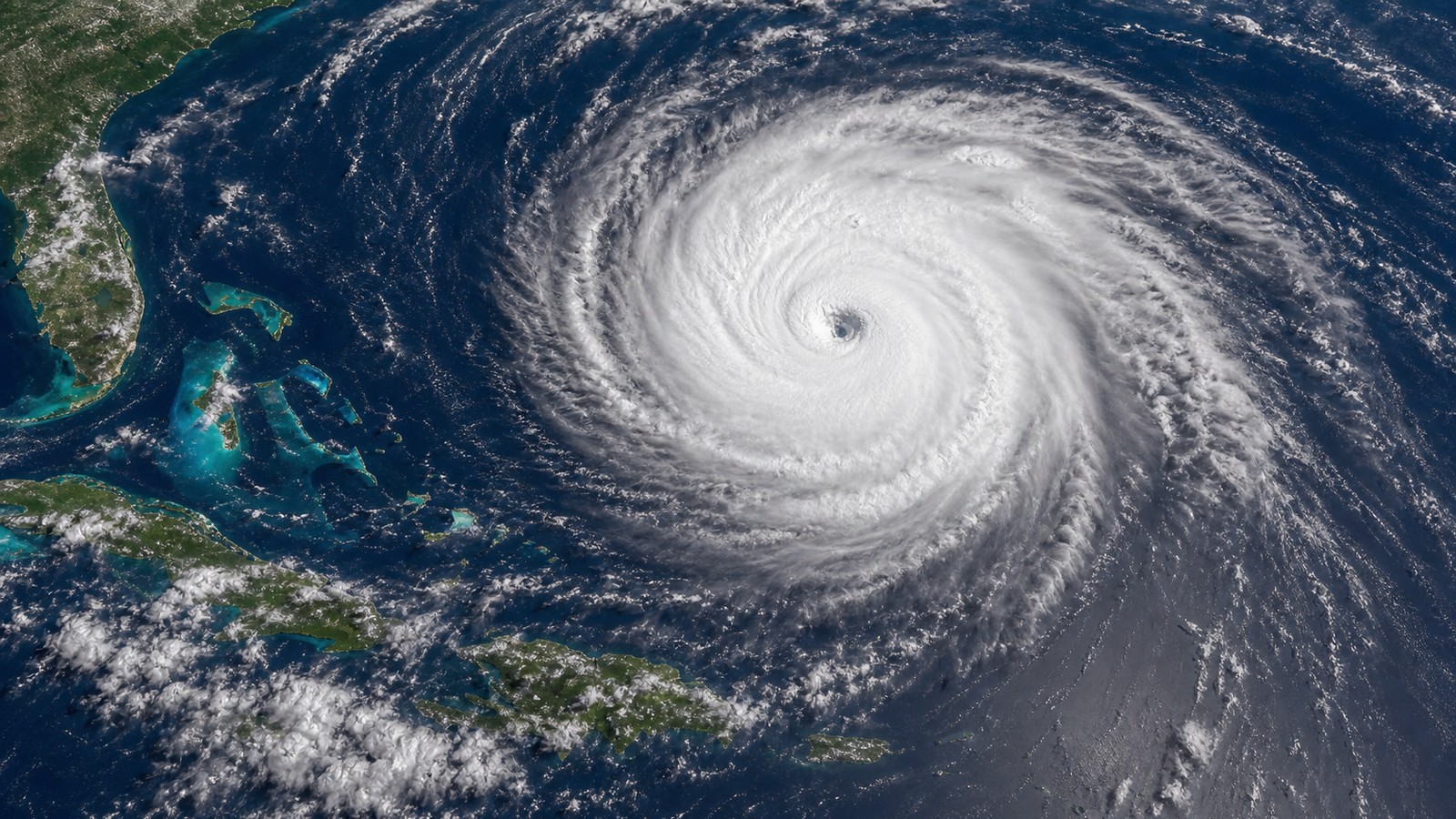 Satellite-style view of a large spiral tropical cyclone over open ocean with no labels or text.